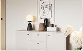 Chest of drawers with decor in the bedroom