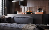 Soft sofa in modern kitchen interior