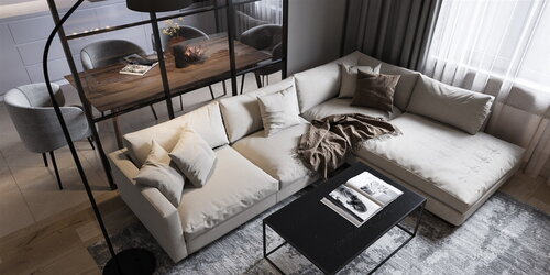 Big soft sofa in the living room with a designer table