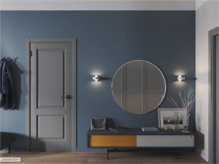  The rich color of the hall with a large round mirror.