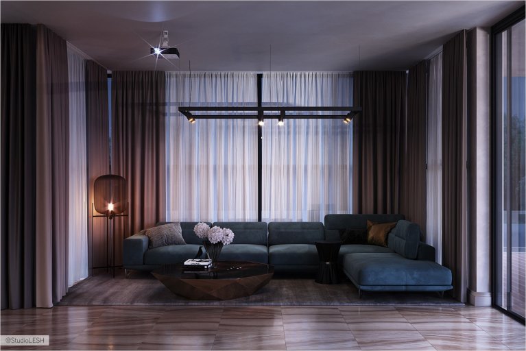 Зона отдыха с большим зеленым диваном