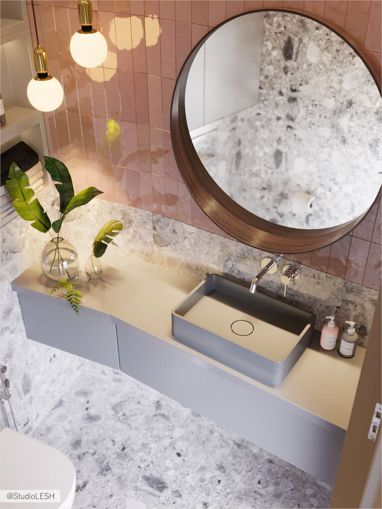 Round mirror and sink in the bathroom