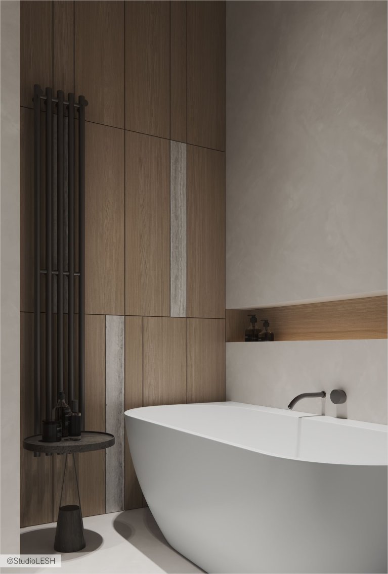 Интерьер современной ванной комнаты с отделкой деревом, белой ванной, черным полотенцесушителем и минималистичной тумбочкой.