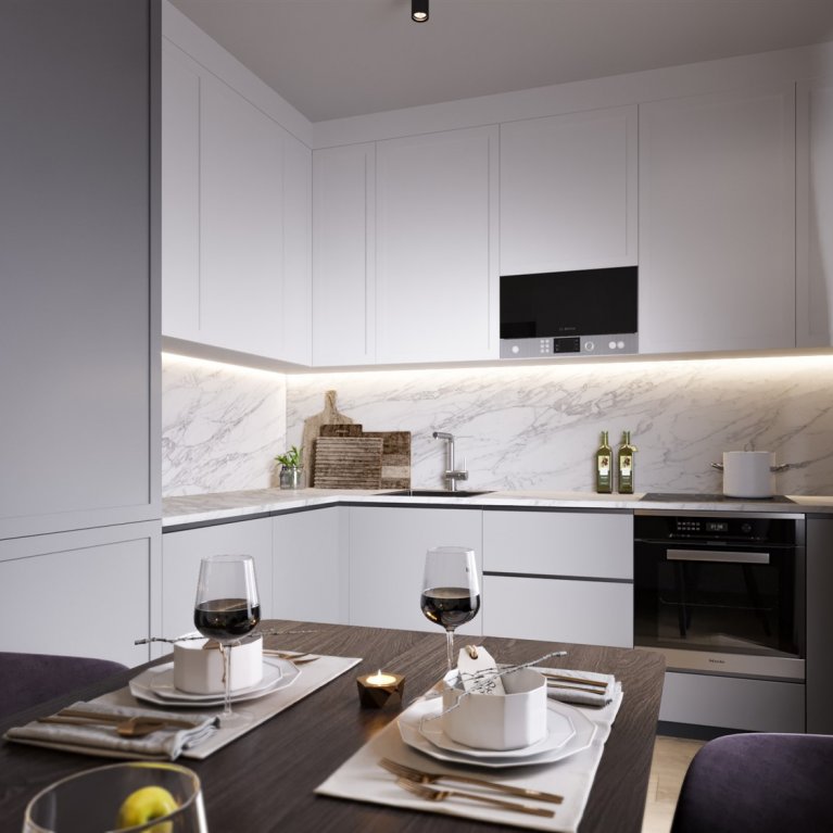  White corner kitchen with sleek facades