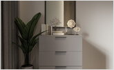  A nightstand in the bedroom in the Scandinavian style with a mirror