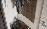Wooden coat rack in the hallway